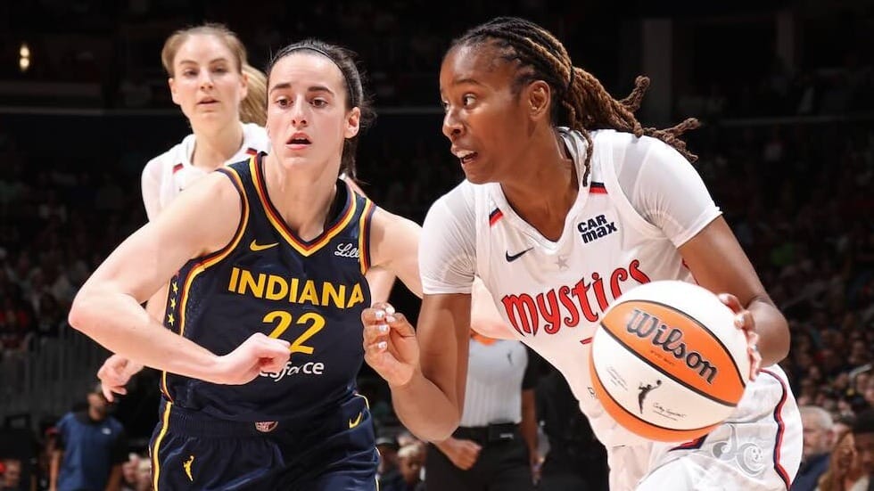 Ariel Atkins of the Mystics drives to the basket against Indiana
