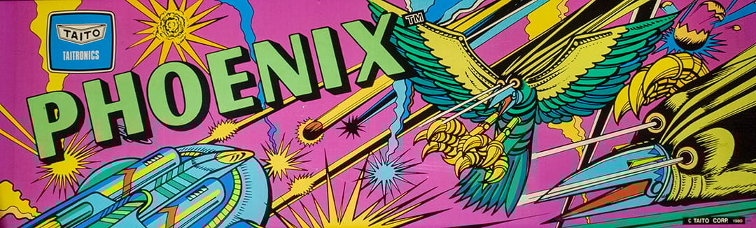 A photo of cabinet art for the Japanese arcade edition of Phoenix, featuring bird-like ships in the midst of a battle.