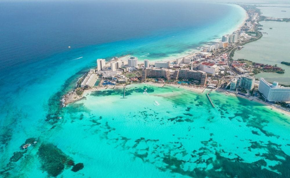 Panoramic aerial view of the beach and hotel zone of Cancun in Mexico. Landscape of the Caribbean coast of the Mexican resort with Playa Caracol beach and the Kukulcan road. Riviera Maya in the Quintana Roo region on