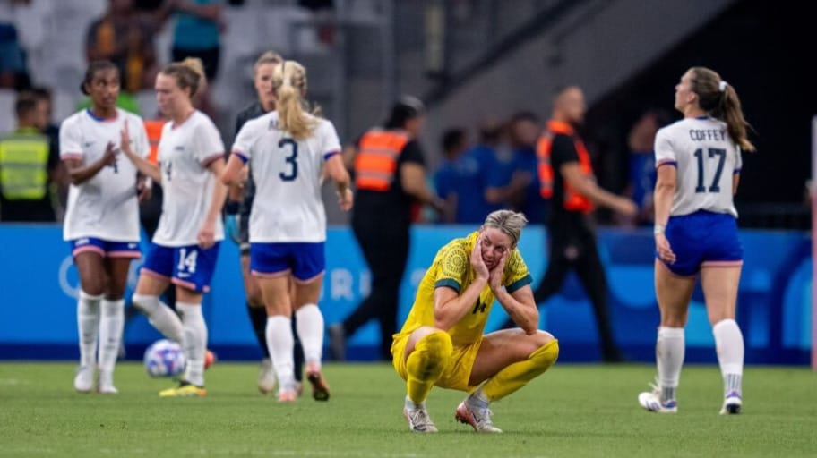 Alanna Kennedy of Australia sits on the field after the Women's Group B match between Australia and USWNT at the Olympics