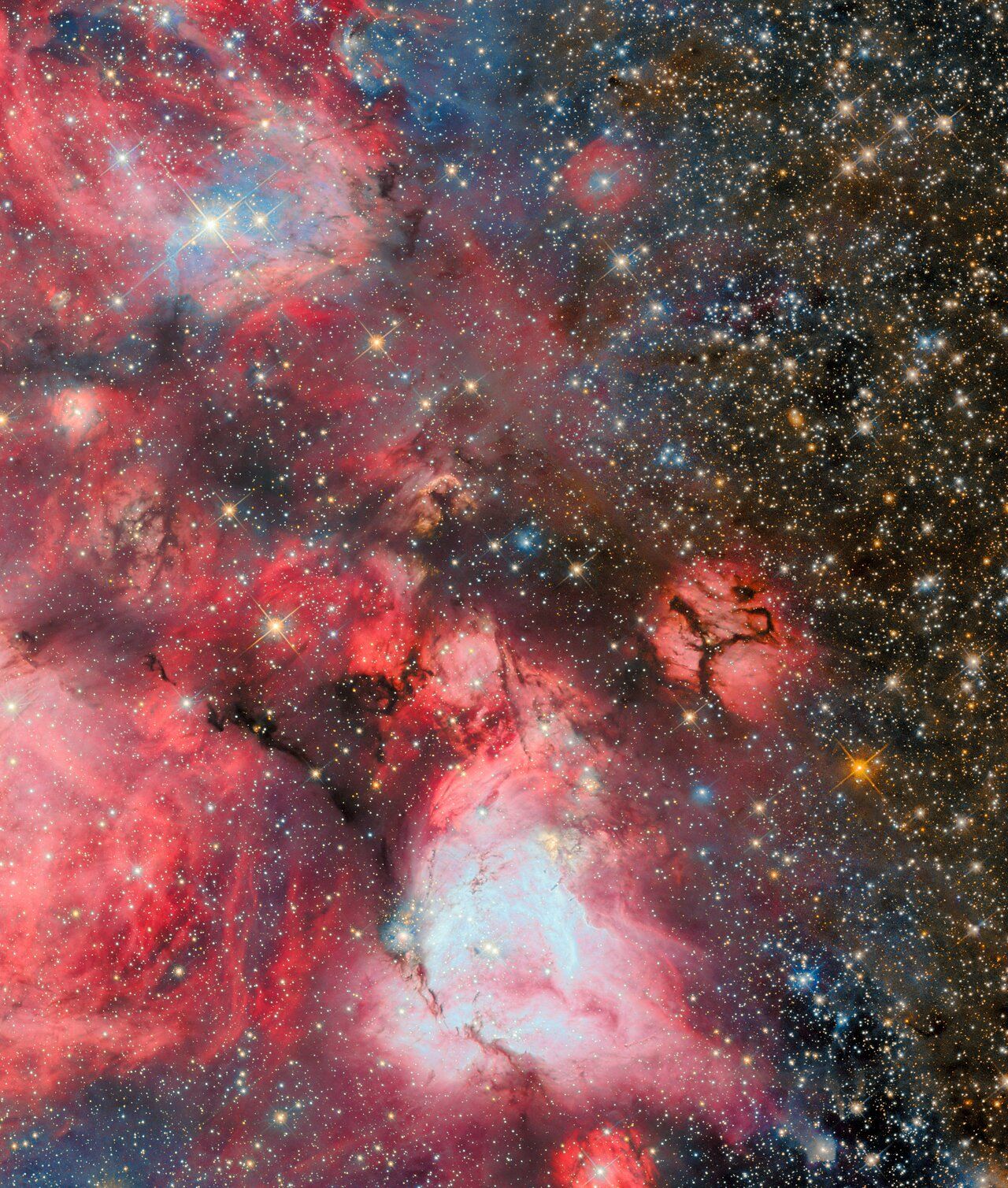 Hubble’s image shows a section of N159, one of the most massive star‑forming clouds in the Large Magellanic Cloud, located about 160,000 light‑years away in the constellation Dorado. The region is dominated by cold hydrogen gas shaped into ridges and filaments, where gravity compresses material into new stars. Hot, high‑mass young stars embedded within the cloud illuminate their surroundings with red light, while their radiation and stellar winds carve out bubble‑like cavities, clear signatures of active stellar feedback. This view captures only a portion of the larger N159 complex, which spans roughly 150 light‑years across.