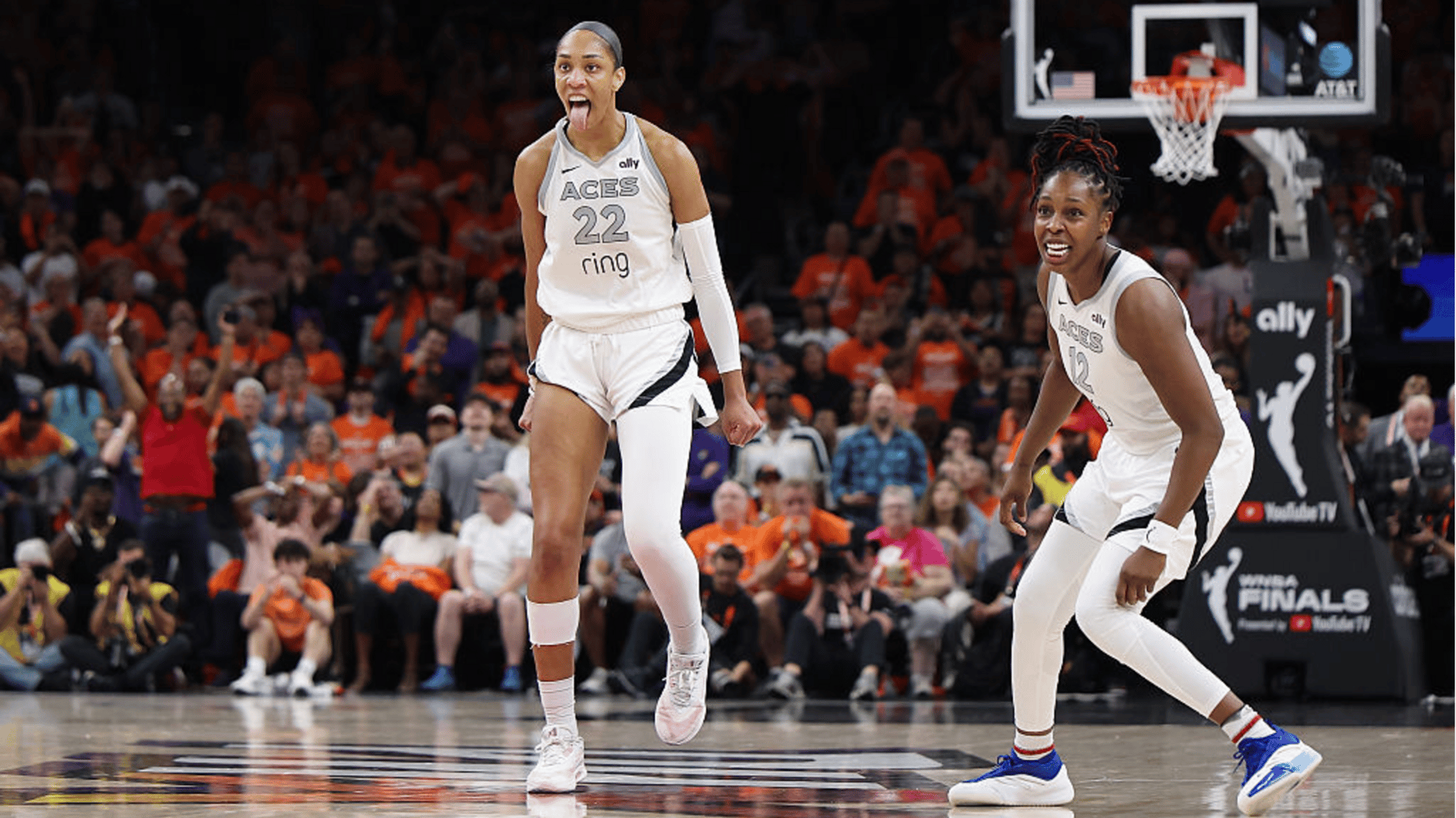 A'ja Wilson #22 of the Las Vegas Aces reacts with Chelsea Gray #12 after her made basket against the Phoenix Mercury with less than one second left in the fourth quarter of Game Three of the 2025 WNBA Playoffs finals