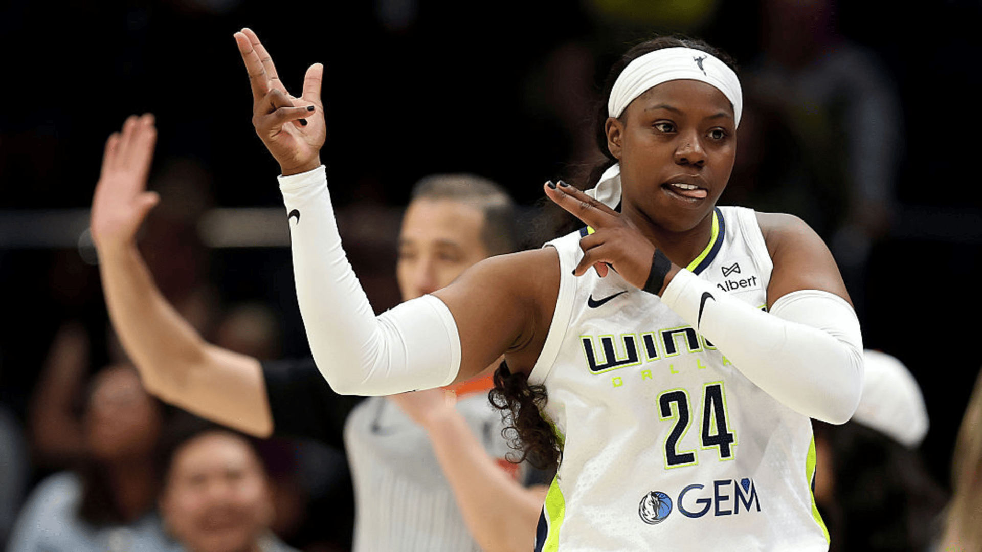 Arike Ogunbowale #24 of the Dallas Wings reacts after her three point basket against the Seattle Storm 