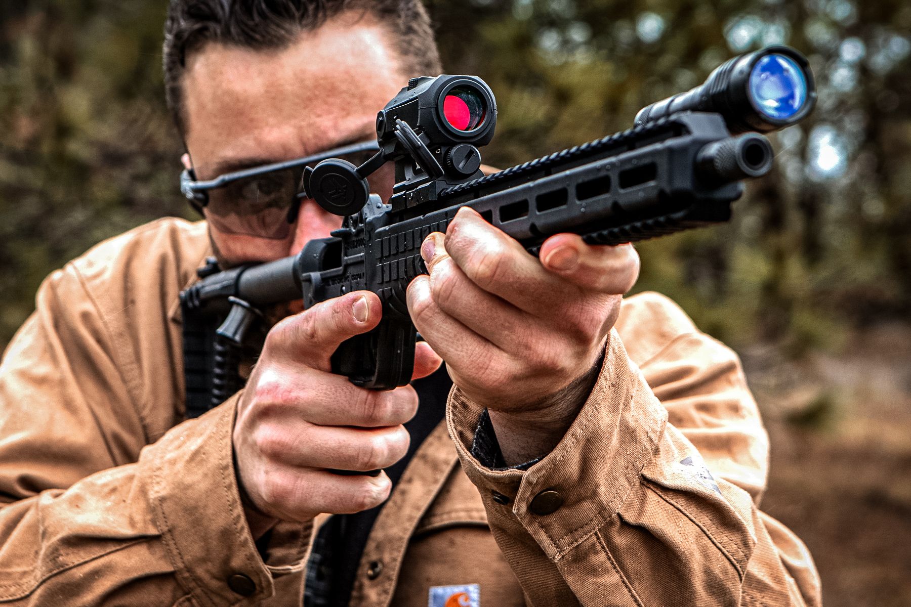 man firing a keltec sub2000