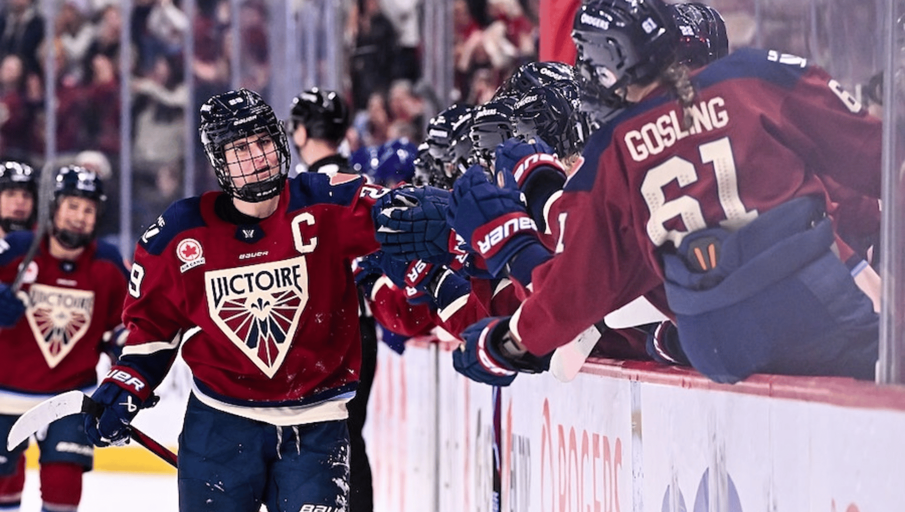 Marie-Philip Poulin #29 of the Montréal Victoire celebrates her goal with teammates on the bench during the third period