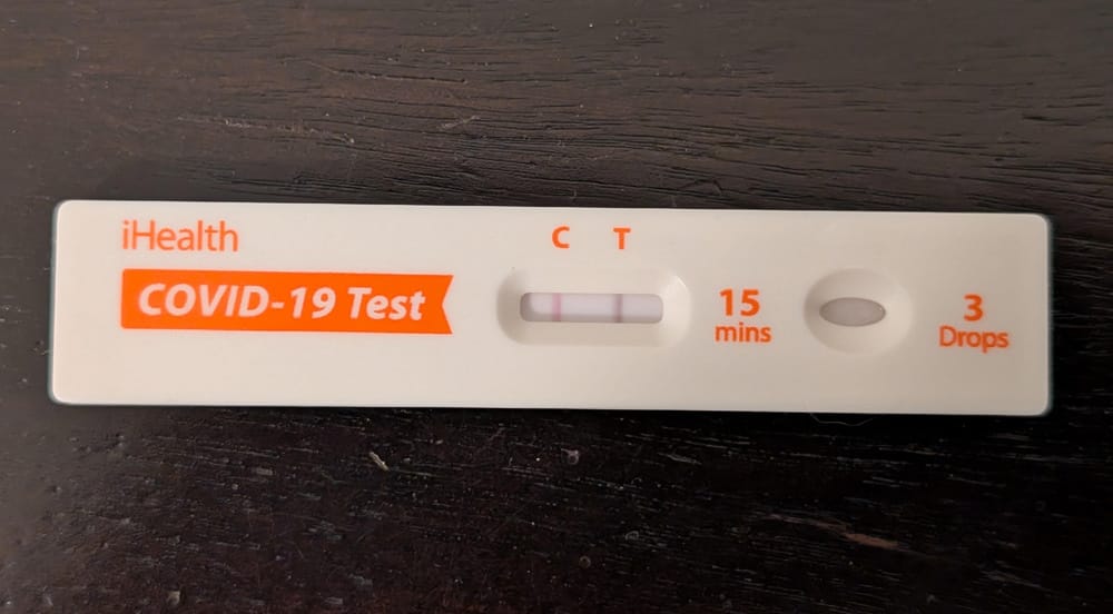 A COVID home test showing a positive result.