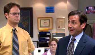 Animated GIF from The Office showing Michael Scott raising his fist and grimacing in frustration while Dwight Schrute stands beside him looking serious.