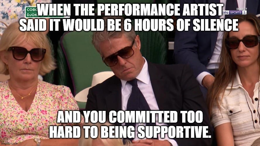 Hugh Grant in a suit and tie asleep at Wimbledon. Overlayed text that reads: When the performance artist said it would be 6 hours of silence and you committed too hard to being supportive.
