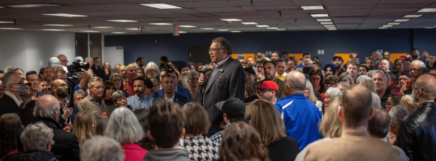 Naheed Nenshi speaks to volunteers in Calgary