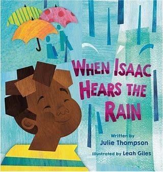 The cover of "When Isaac Hears the Rain". It features a little boy smiling in the rain, with a trio of umbrellas in the background.