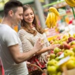 millennials change food industry - millennial couple buys product at market