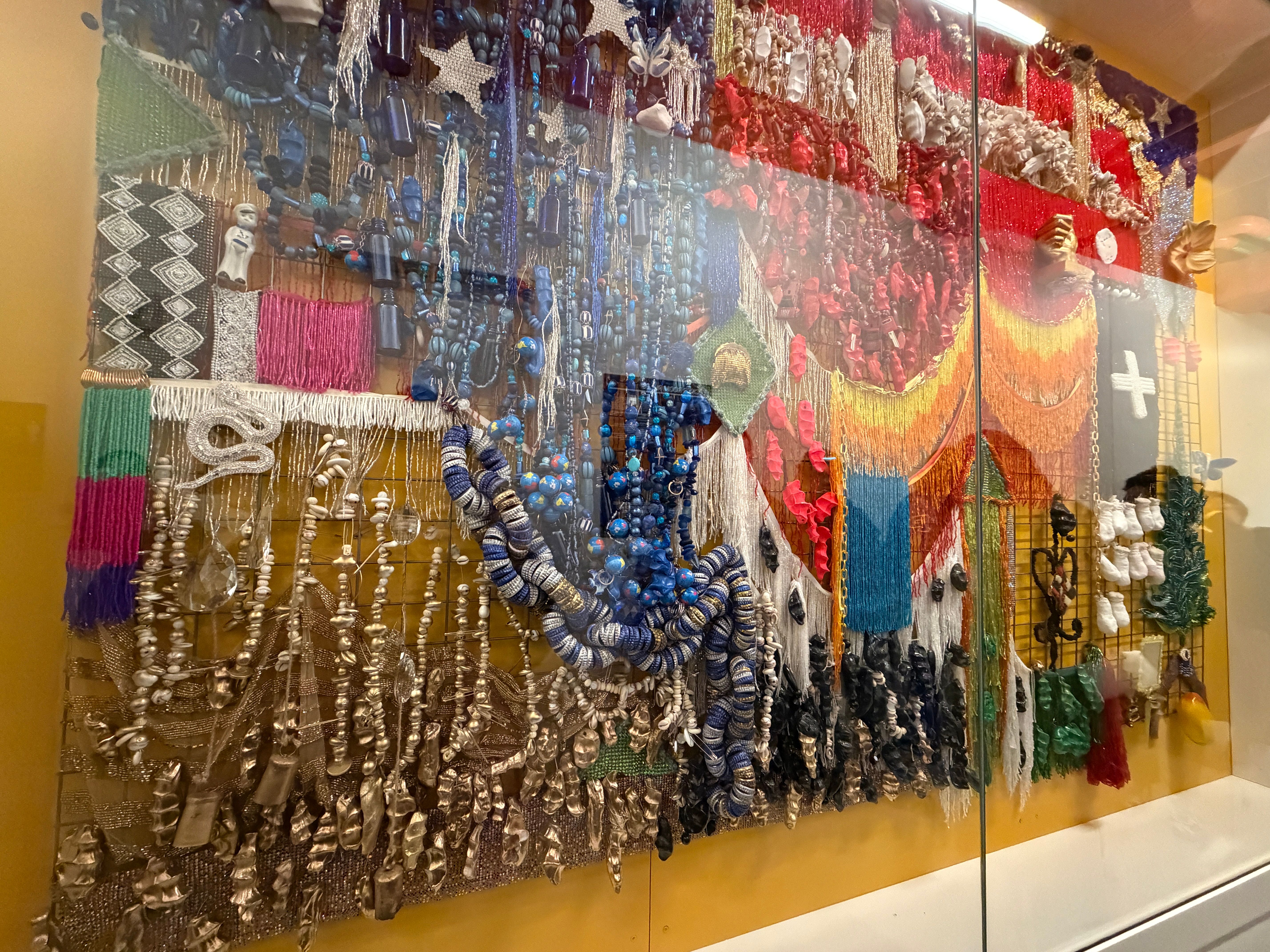 3 dimensional artwork made of found objects in a glass vitrine