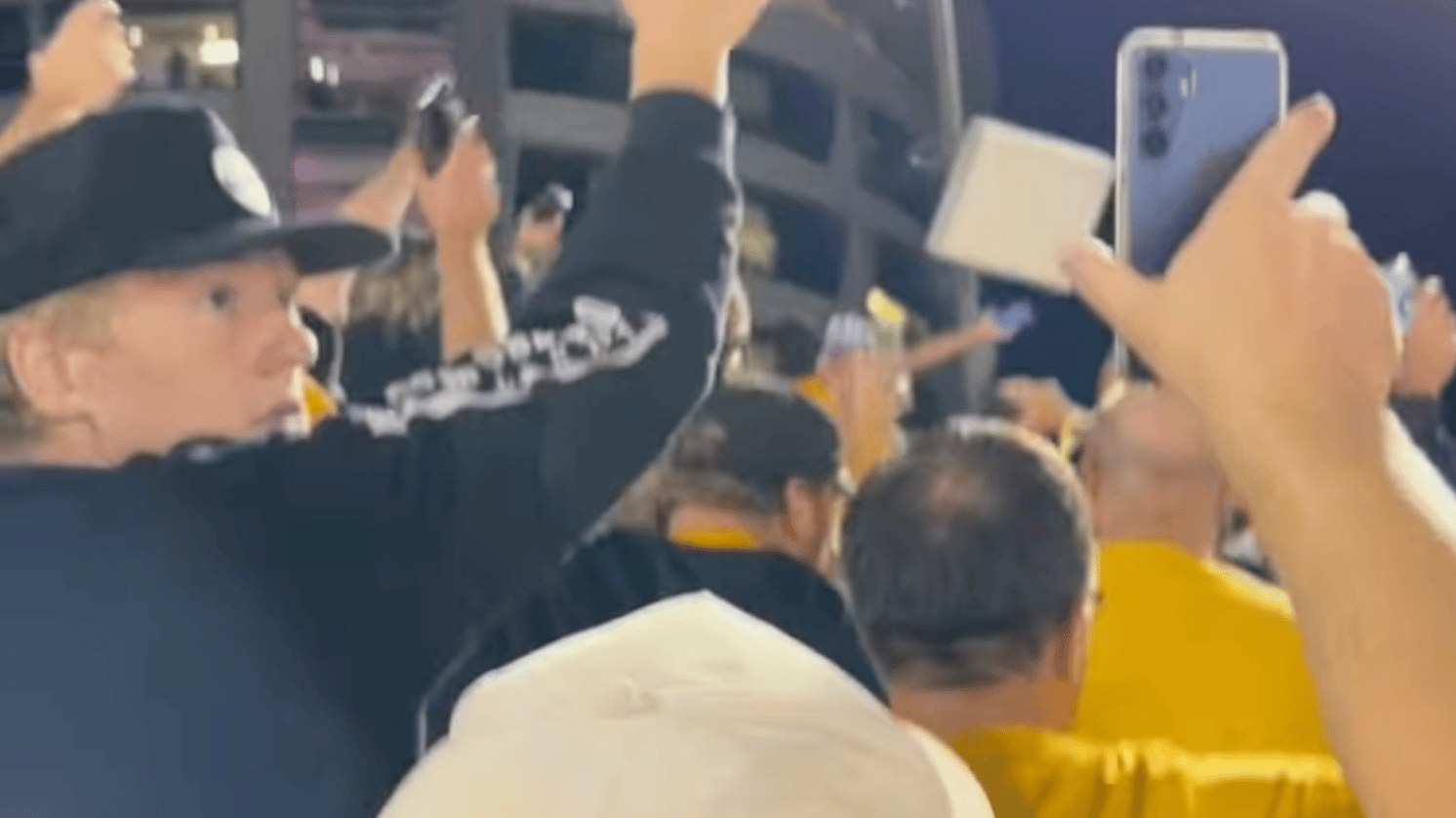 university of iowa football fans waving to children in hospital