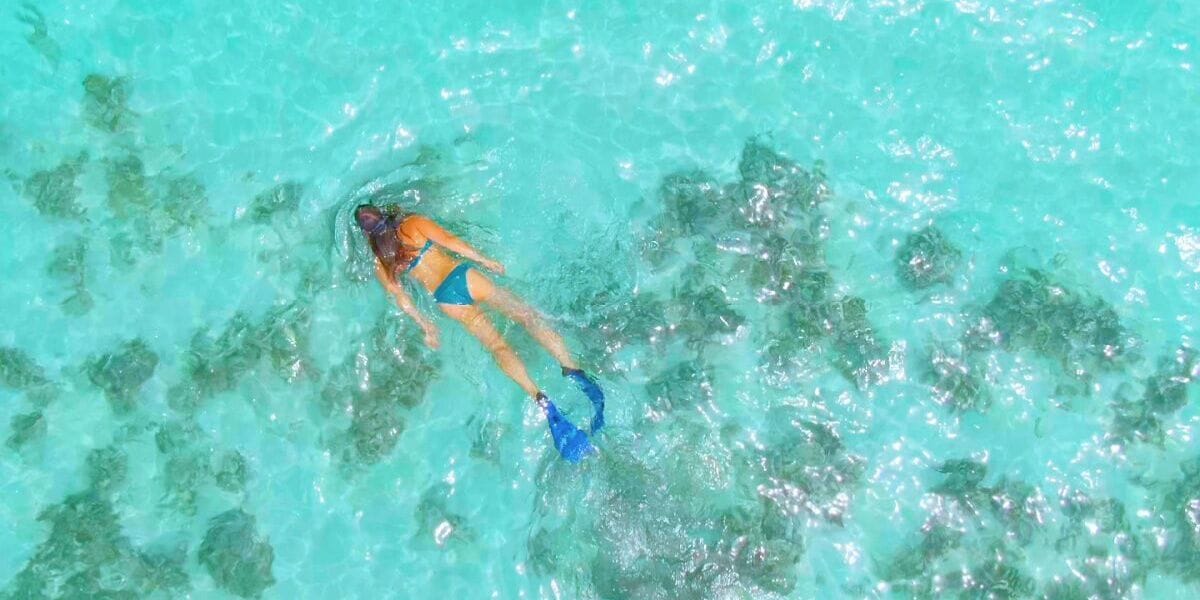a girl swimming in the ocean