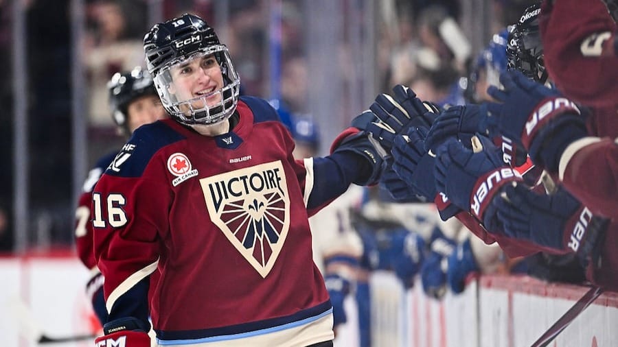 Hayley Scamurra #16 of the Montréal Victoire celebrates her empty net goal with teammates on the bench during the third period against the Vancouver Goldeneyes 