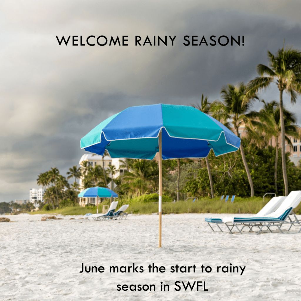 A beach with two chairs and an umbrella.