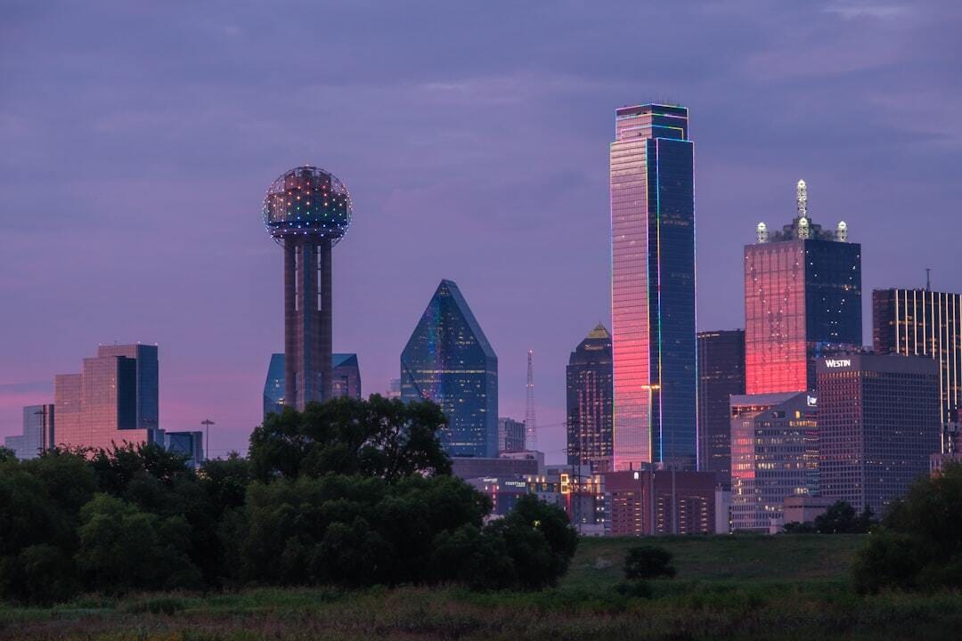 Close up of Dallas Skyline at sunset with multicolored LED lights.