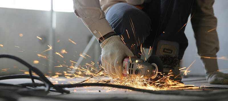 Worker using a power cutting tool with sparks flying - symbolizing hard work and building a meaningful career.