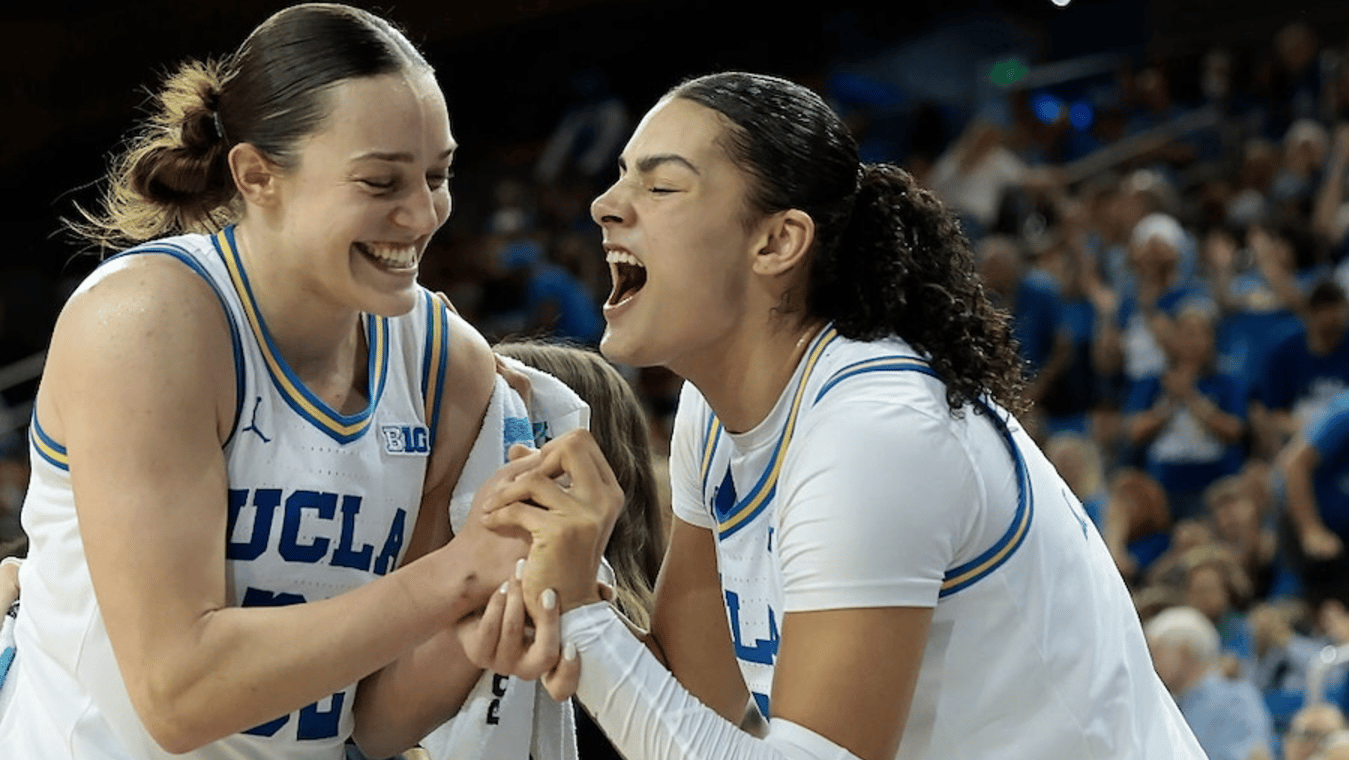 Angela Dugalić #32 and Lauren Betts #51 of the UCLA Bruins react against the Iowa Hawkeyes