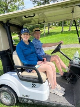 Chad playing golf with his daughter