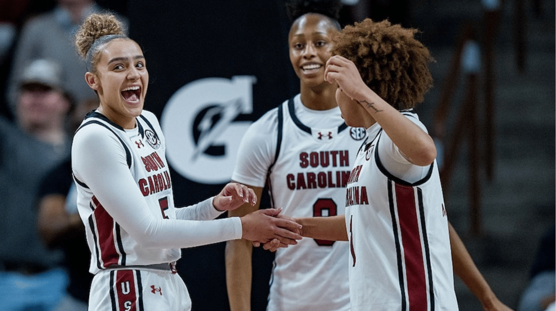 Tessa Johnson #5, Joyce Edwards #8, and Maddy McDaniel #1 of the South Carolina Gamecocks react in the second half against the Vanderbilt Commodores