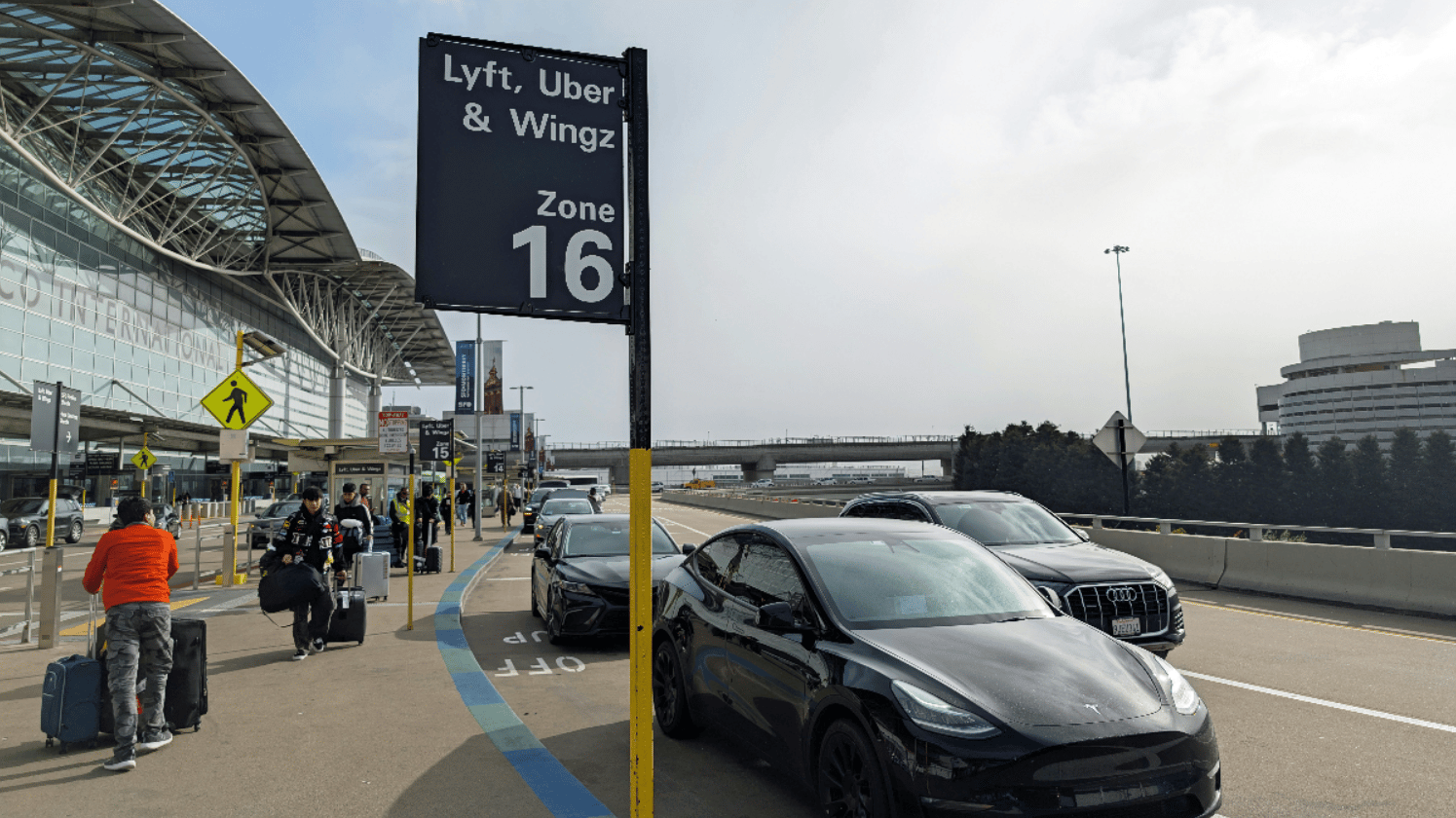 a car waiting at a rideshare area at an airport