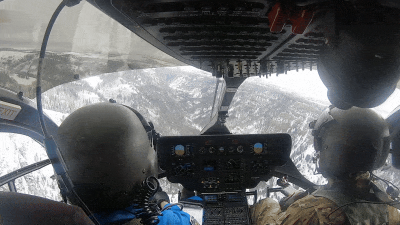 NASA astronaut Bob Hines (left) trains with Colorado Army National Guard HAATS instructor Ethan Jacobs in the Rocky Mountains in April 2025, rehearsing landing procedures under challenging terrain and visibility conditions. Seasonal snow or dust in the region can obscure visual cues—an effect comparable to the lunar dust astronauts may encounter during future missions to the Moon’s surface.