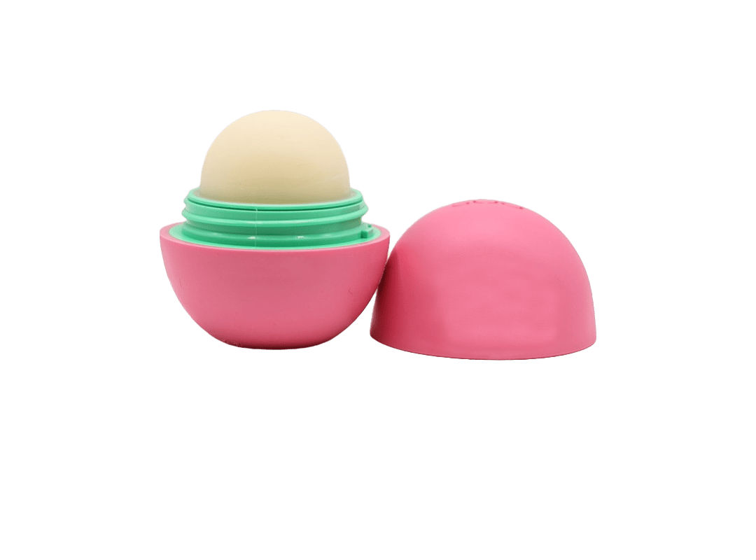 Pink and green sphere-shaped lip balm open to show interior, an example of small yet memorable promotional gifts for clients and employees.
