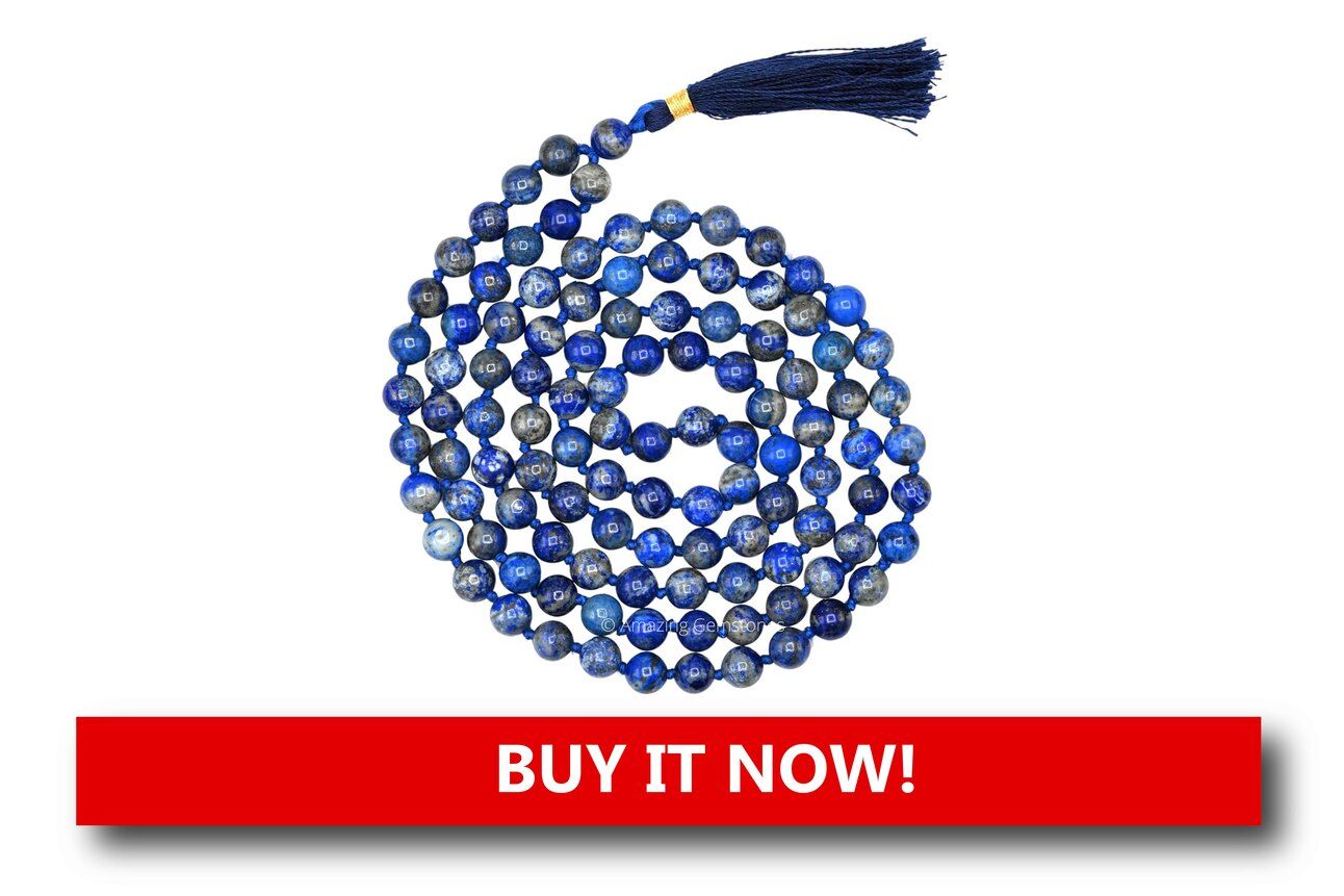 Lapis Lazuli Prayer Beads Alt text: Rich blue lapis lazuli prayer beads with gold accents and a small cross pendant, displayed with festive decor for a luxurious Christmas feel.