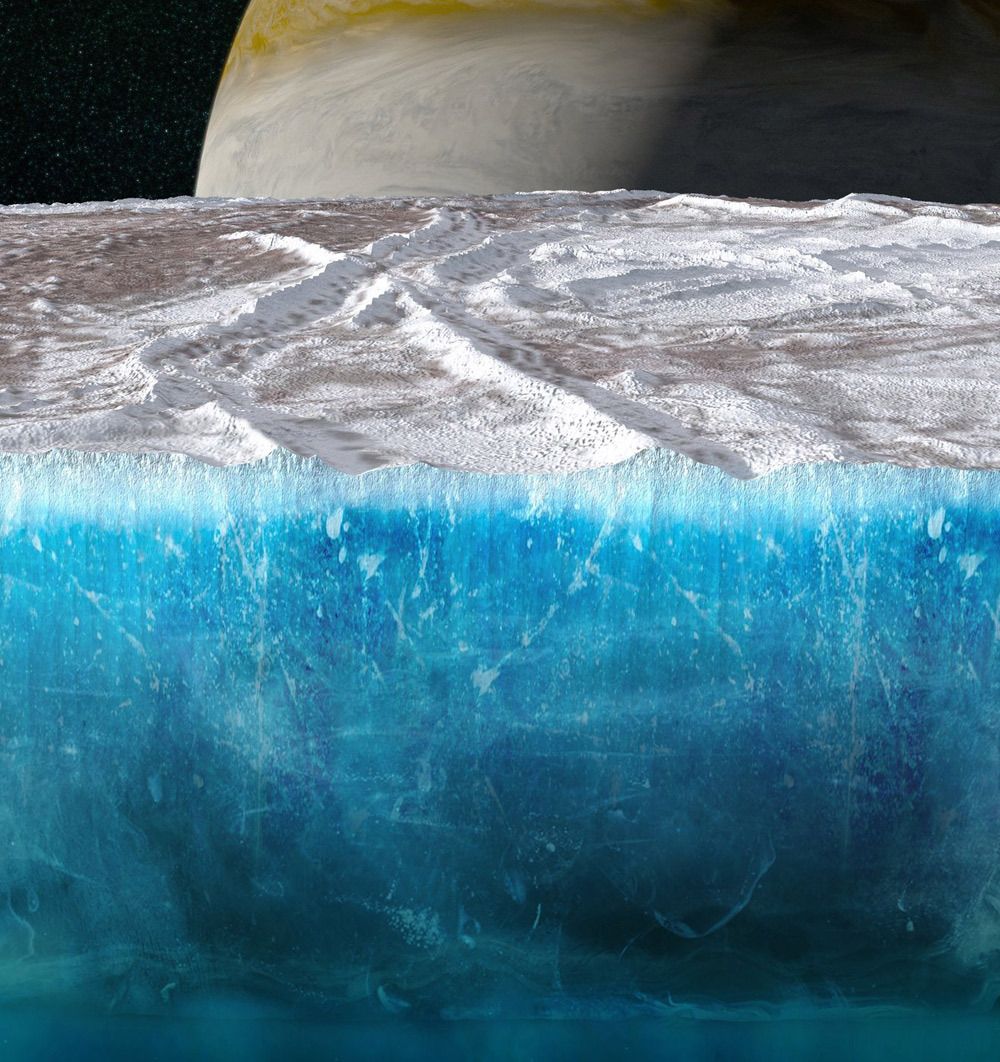 Artwork depicting a cutaway of Europa’s surface, showing the thick ice shell, white on the surface and bluer with depth, above an ocean. Jupiter can be seen on the horizon.