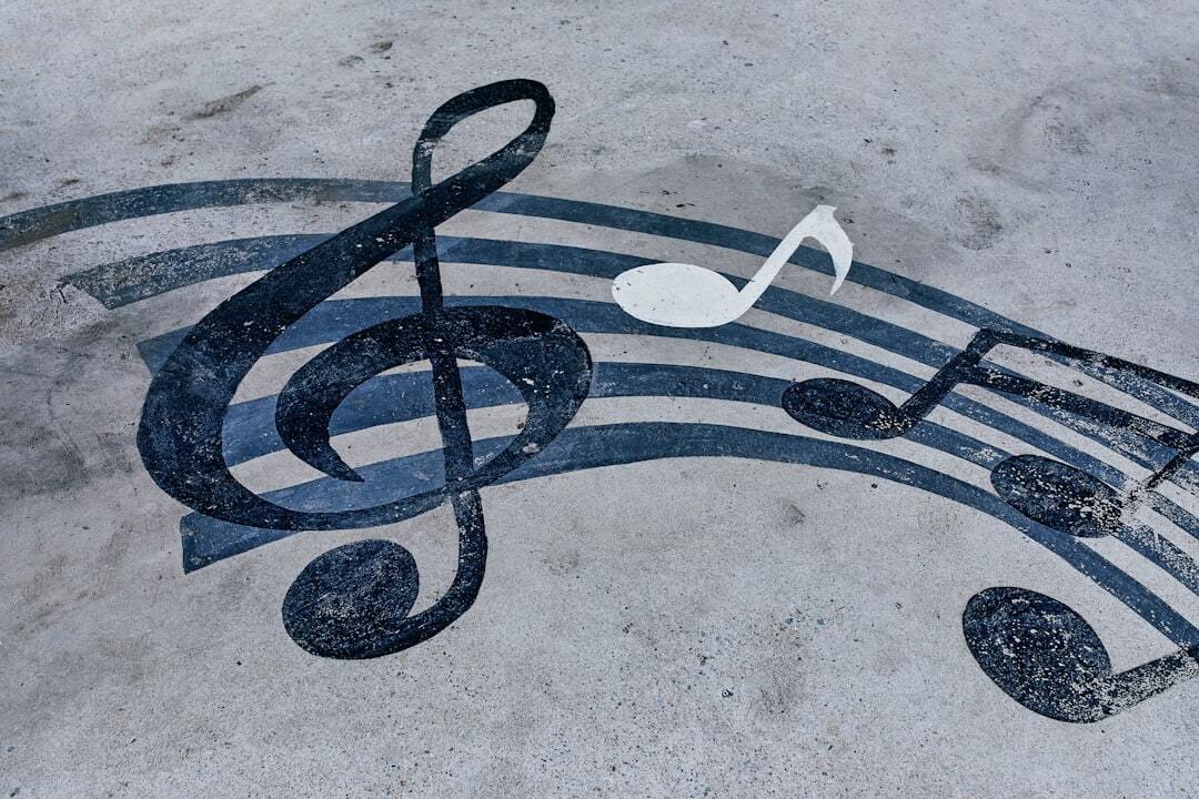 Notes drawn on a muddy road. Horizontal background with musical notes