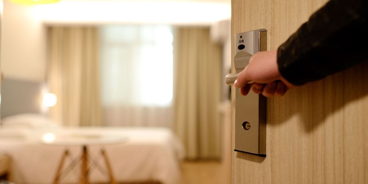 someone opening up their hotel door