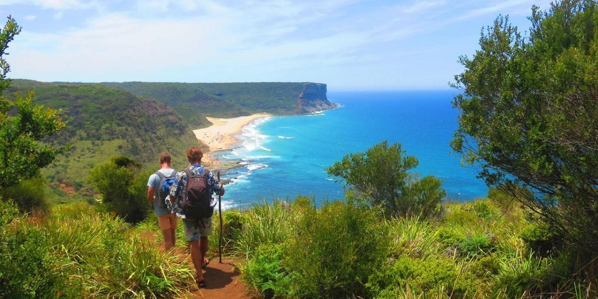 two hikers hiking a path in Australia