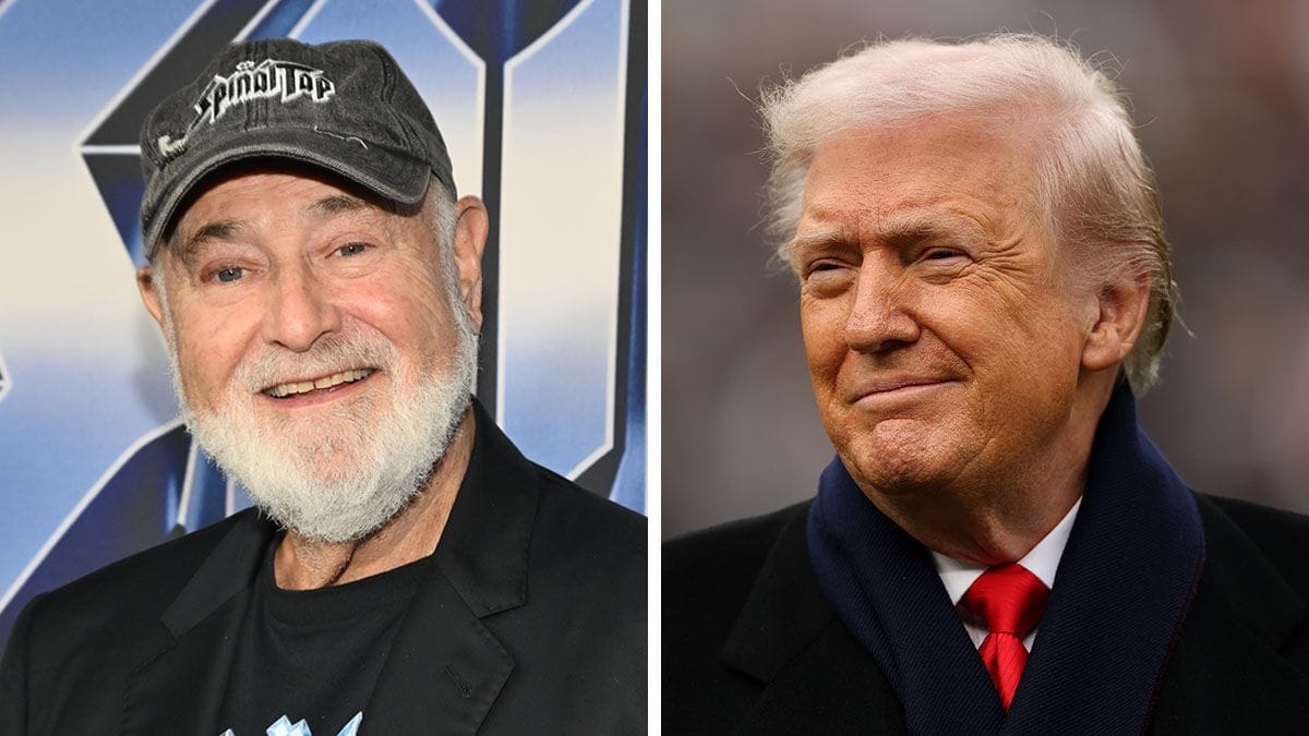 Two white men are pictured next to each other. The man on the left is smiling wide at the camera, while the man on the right is smiling as well.