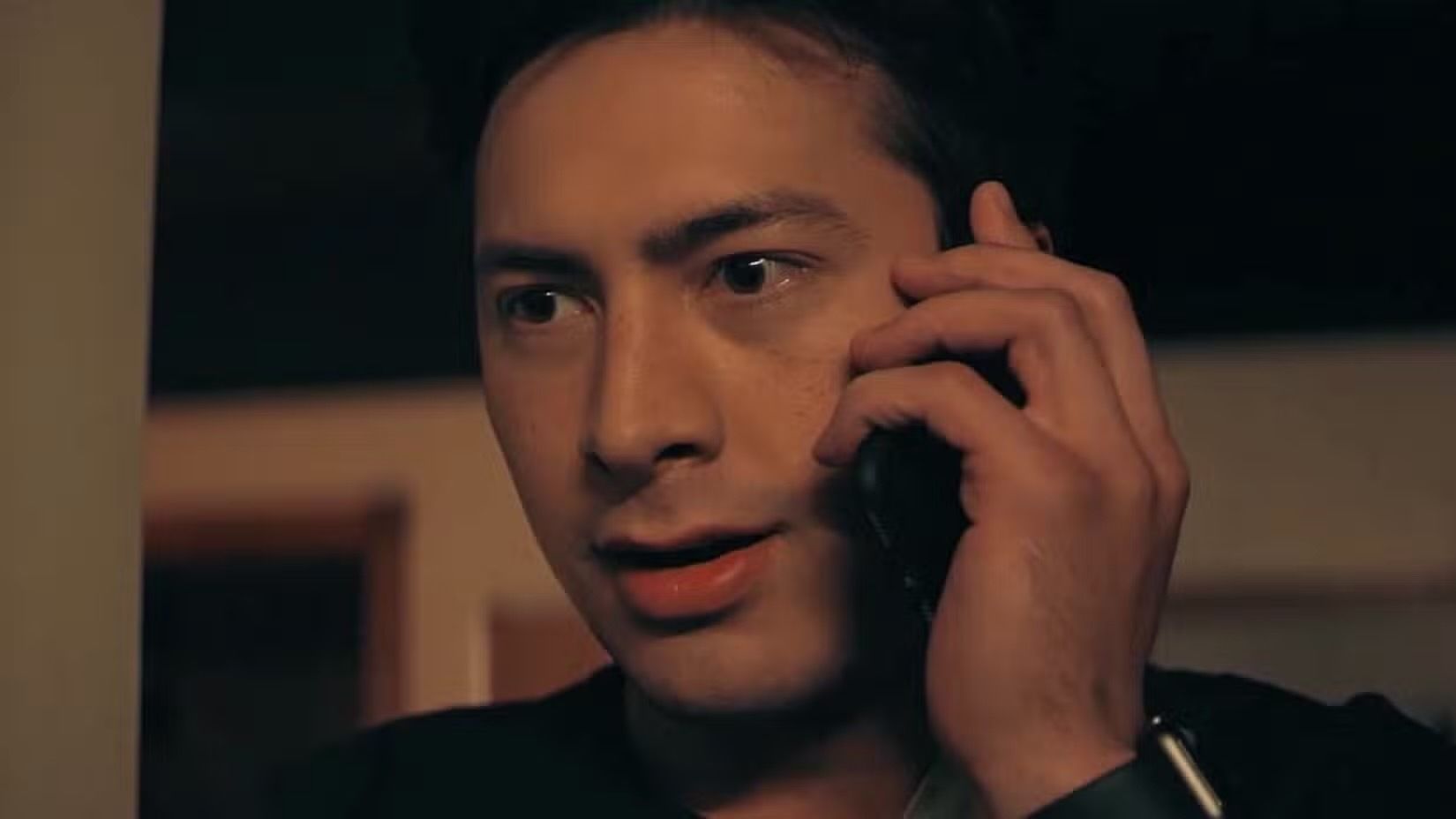 Close-up of Shane talking on the phone in Episode 5 of Heated Rivalry.