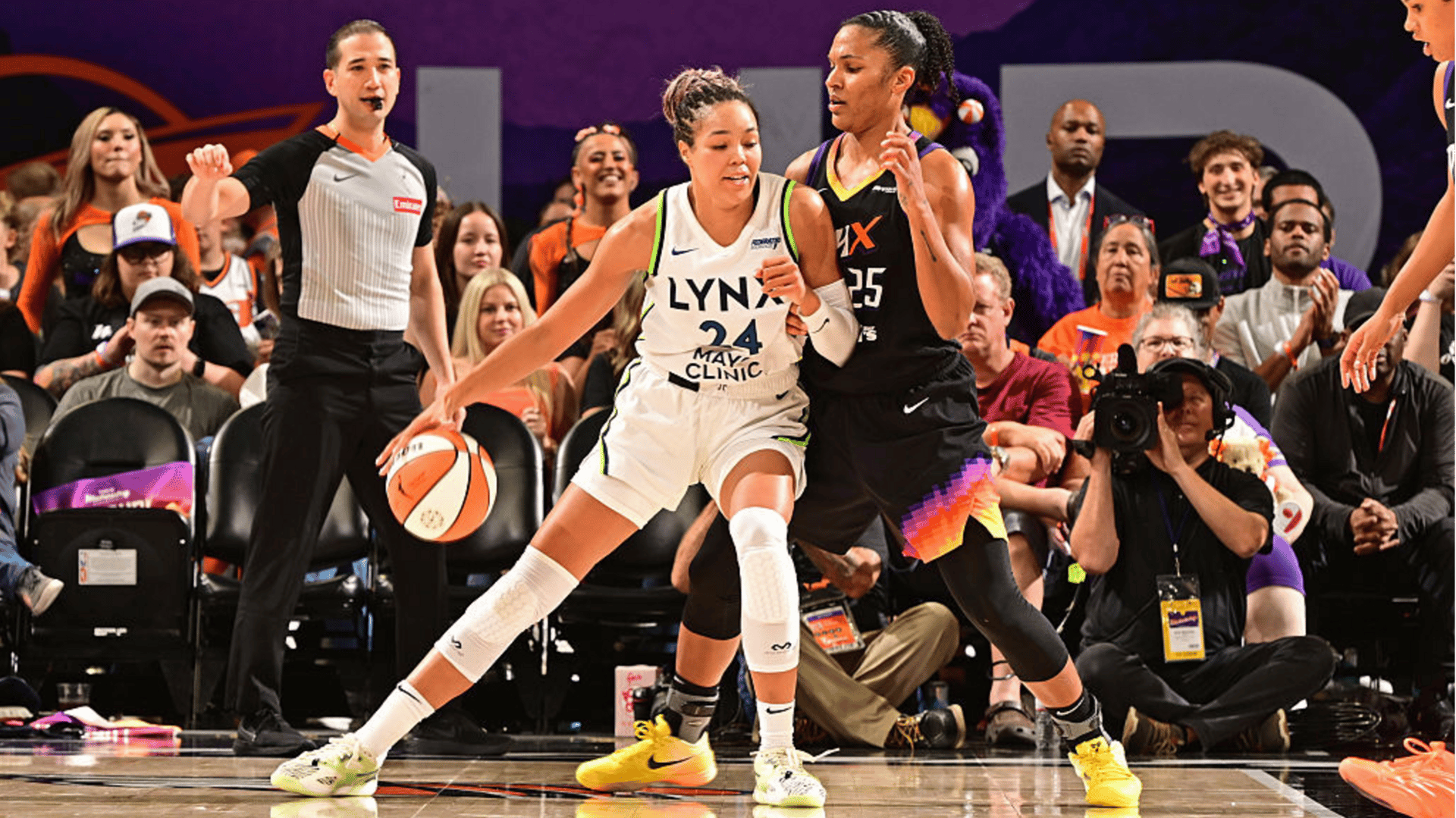 Alyssa Thomas #25 of the Phoenix Mercury plays defense as Napheesa Collier #24 of the Minnesota Lynx dribbles the ball during Round 2 Game 3 of the 2025 WNBA Playoffs on September 26, 2025 at PHX Arena in Phoenix, Arizona.