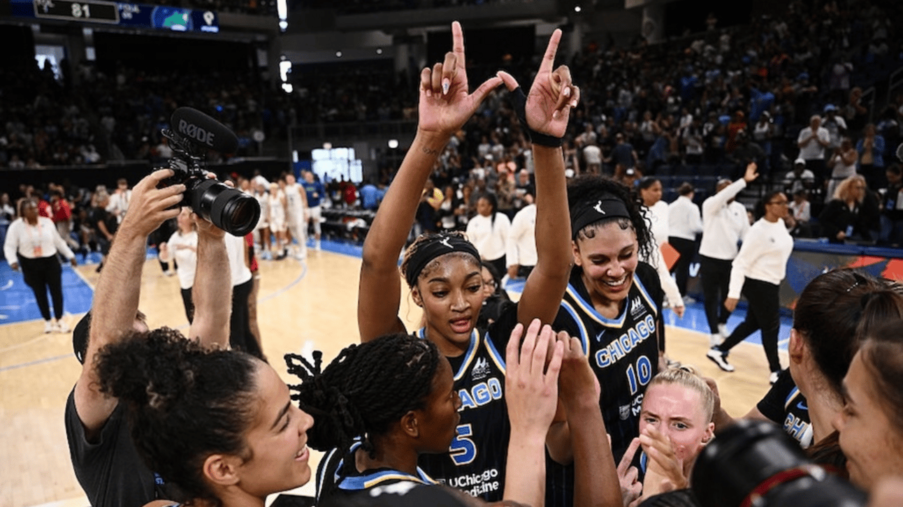 Angel Reese #5 celebrates as the Chicago Sky huddle after the game against the Minnesota Lynx
