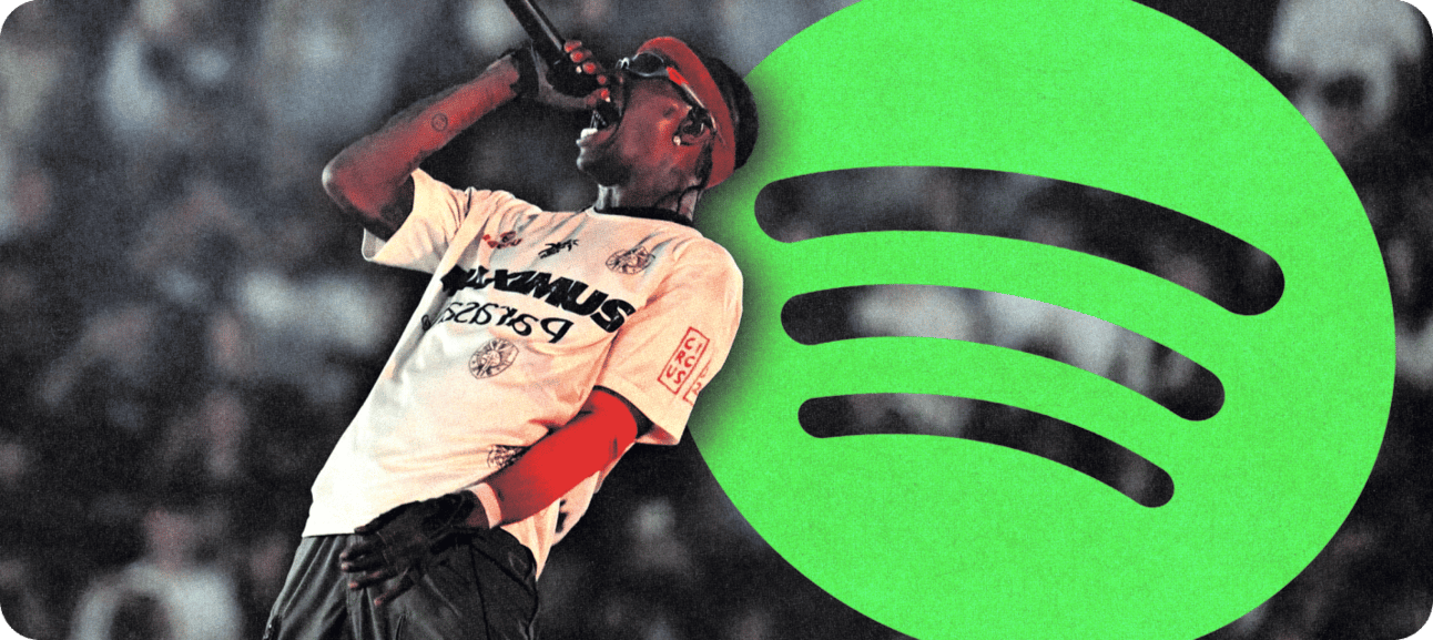 Travis Scott rapping in front of spotify logo