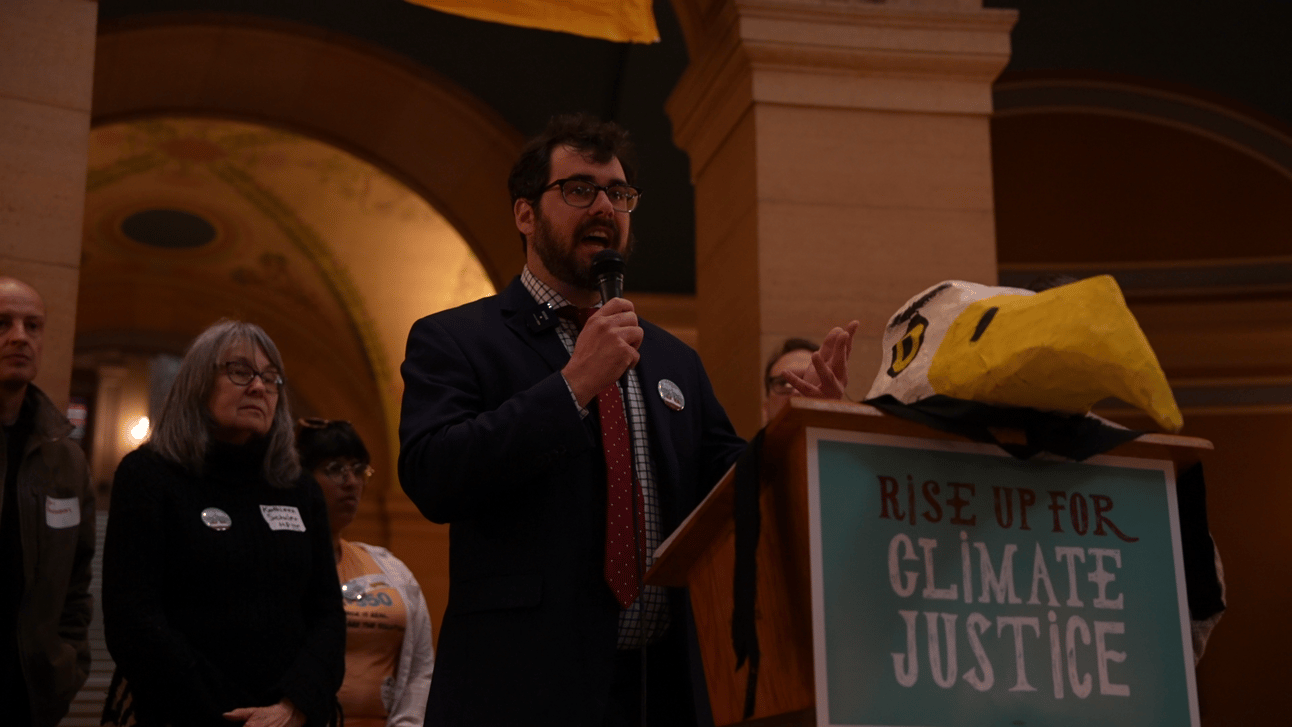 Jordan Haedtler peaking at a climate rally in Minnesota’s state capitol.s