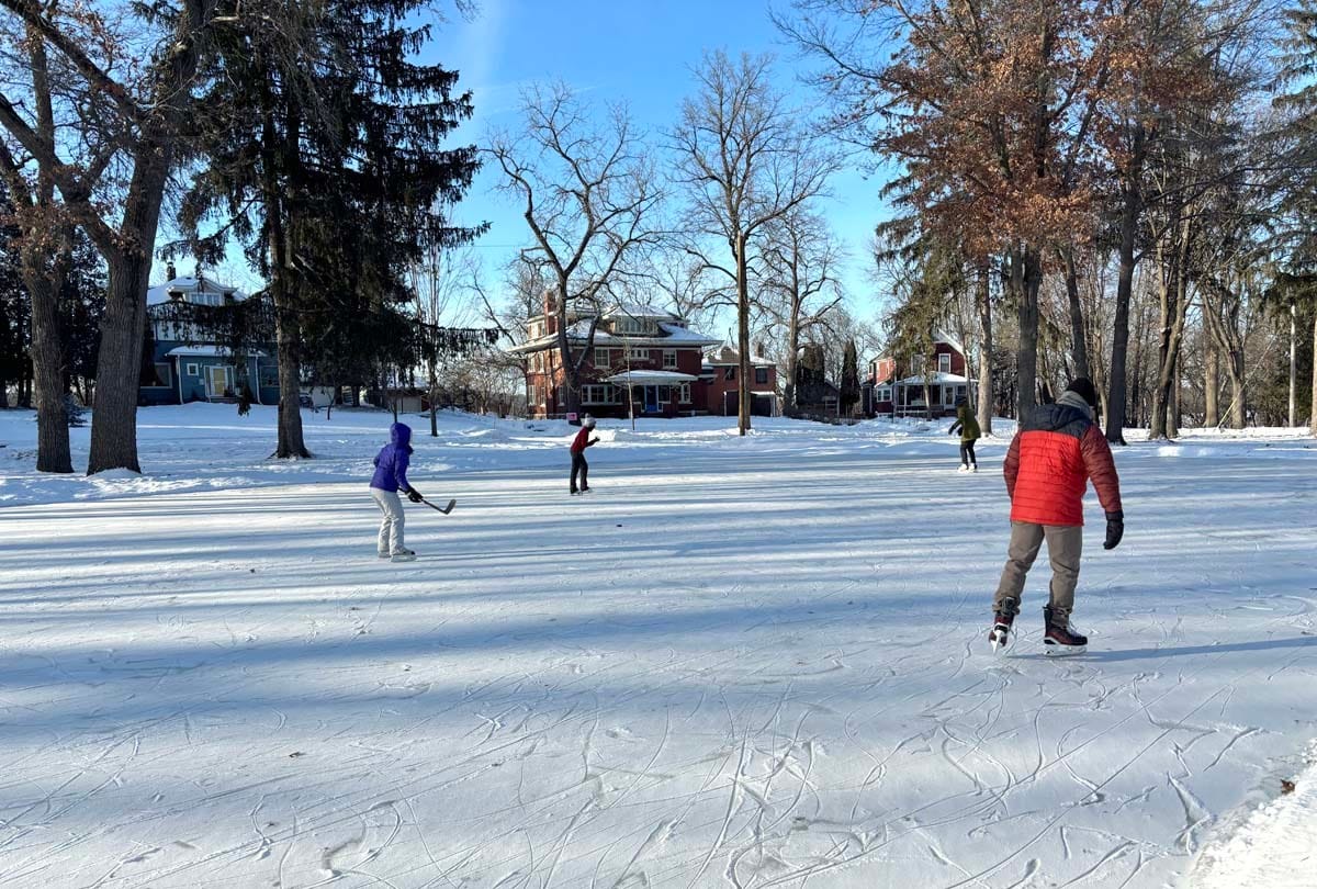 Youngsters play hockey and skate at Menomonie's Half Moon park on a cold day.