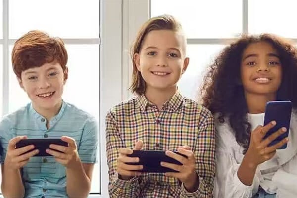 Three kids and their phones.