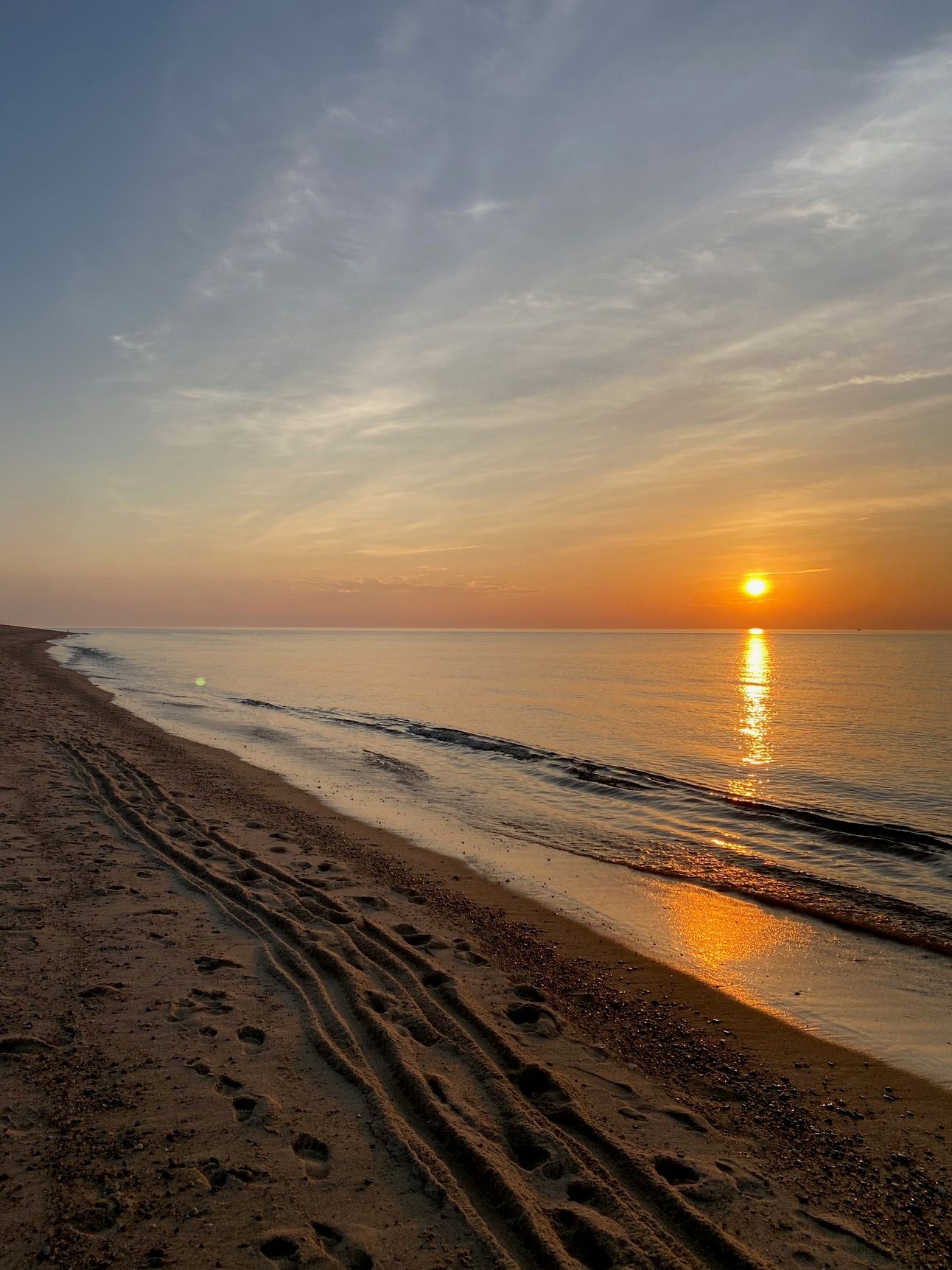 Sunset at Race Point Beach; the sun casting a golden trail on the water..