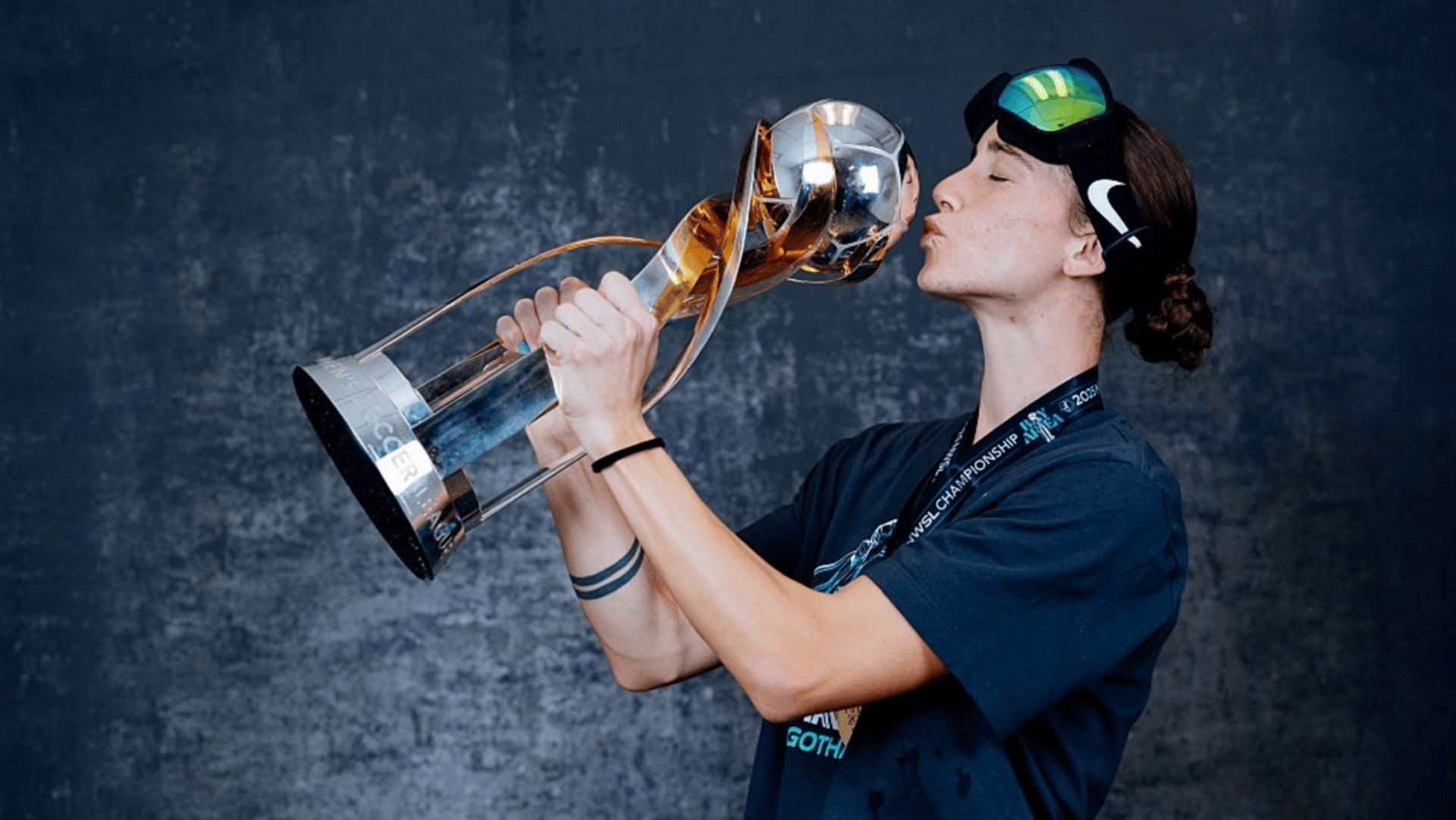 Ella Stevens of Gotham FC poses with the trophy following their win over the Washington Spirit 