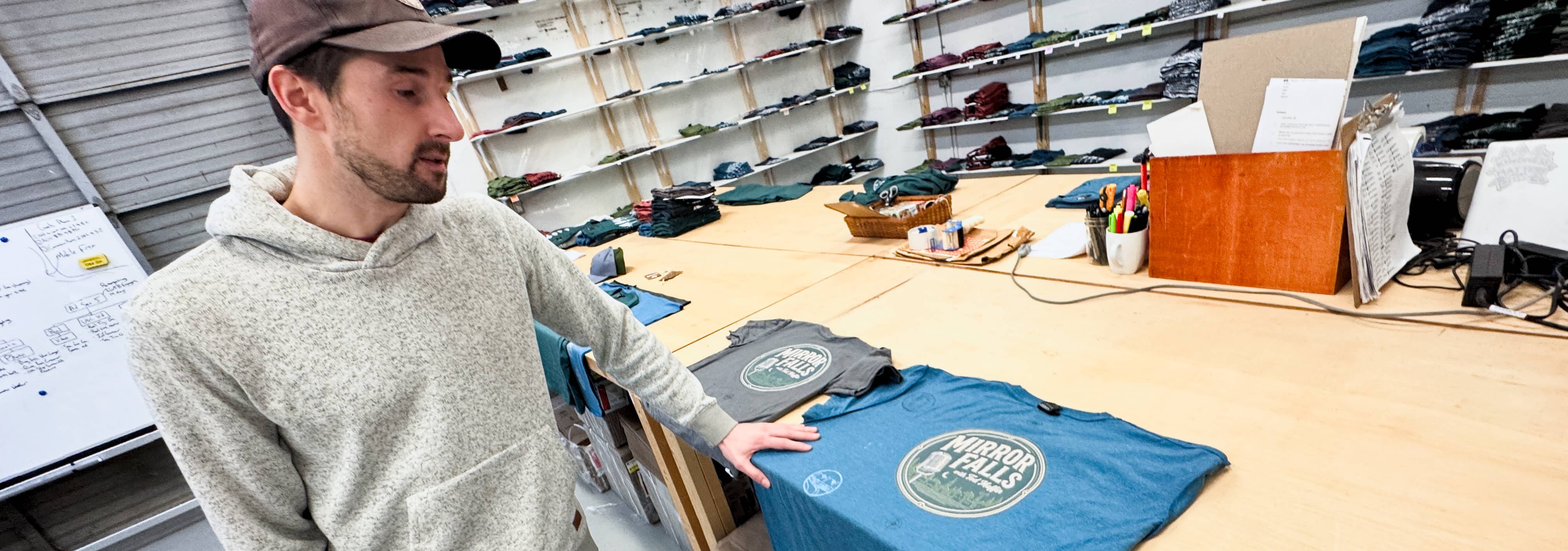 Martin looks over an early proof of Tod’s Mirror Falls merch