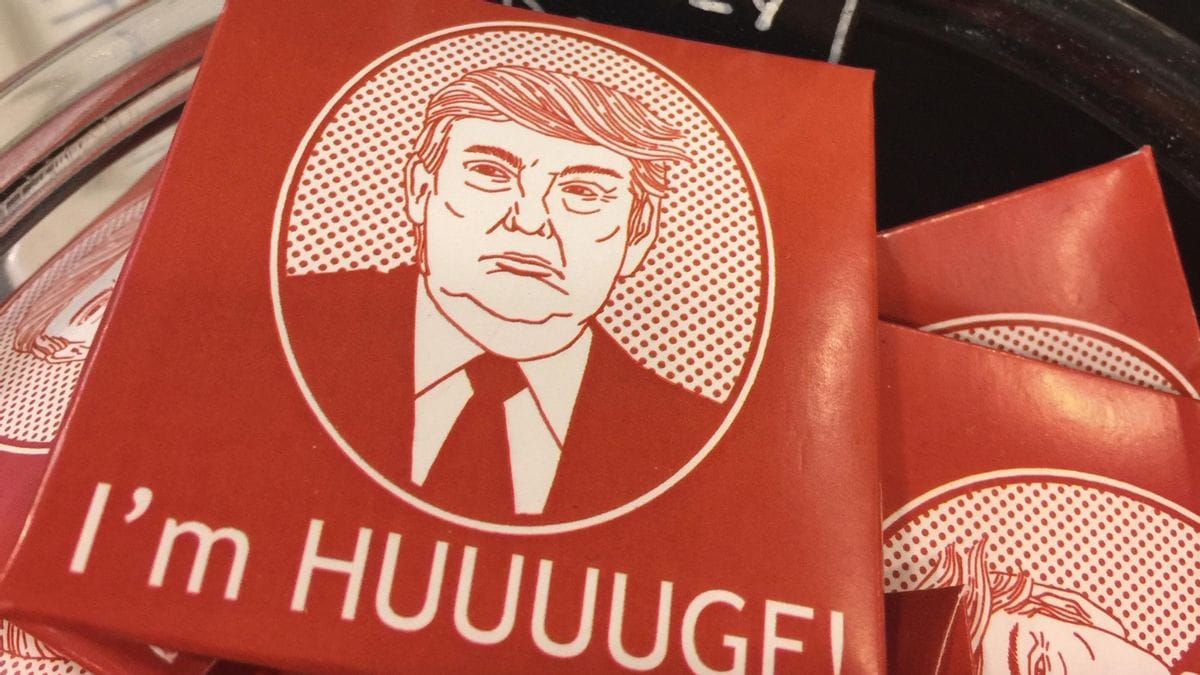 A red condom box shows an illustration of a white man. Below the image, white words say, "I'm HUUUUGE!"