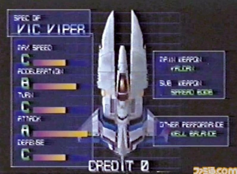 A screenshot of the vehicle select screen from Vic Viper: Battle Racing, showing the titular Vic Viper. Max Speed, Acceleration, Turn, Attack Defense, Main Weapon, Subweapon, and "Other Performance" are the categories displayed, while the ship itself is shown in the middle from a top-down view.