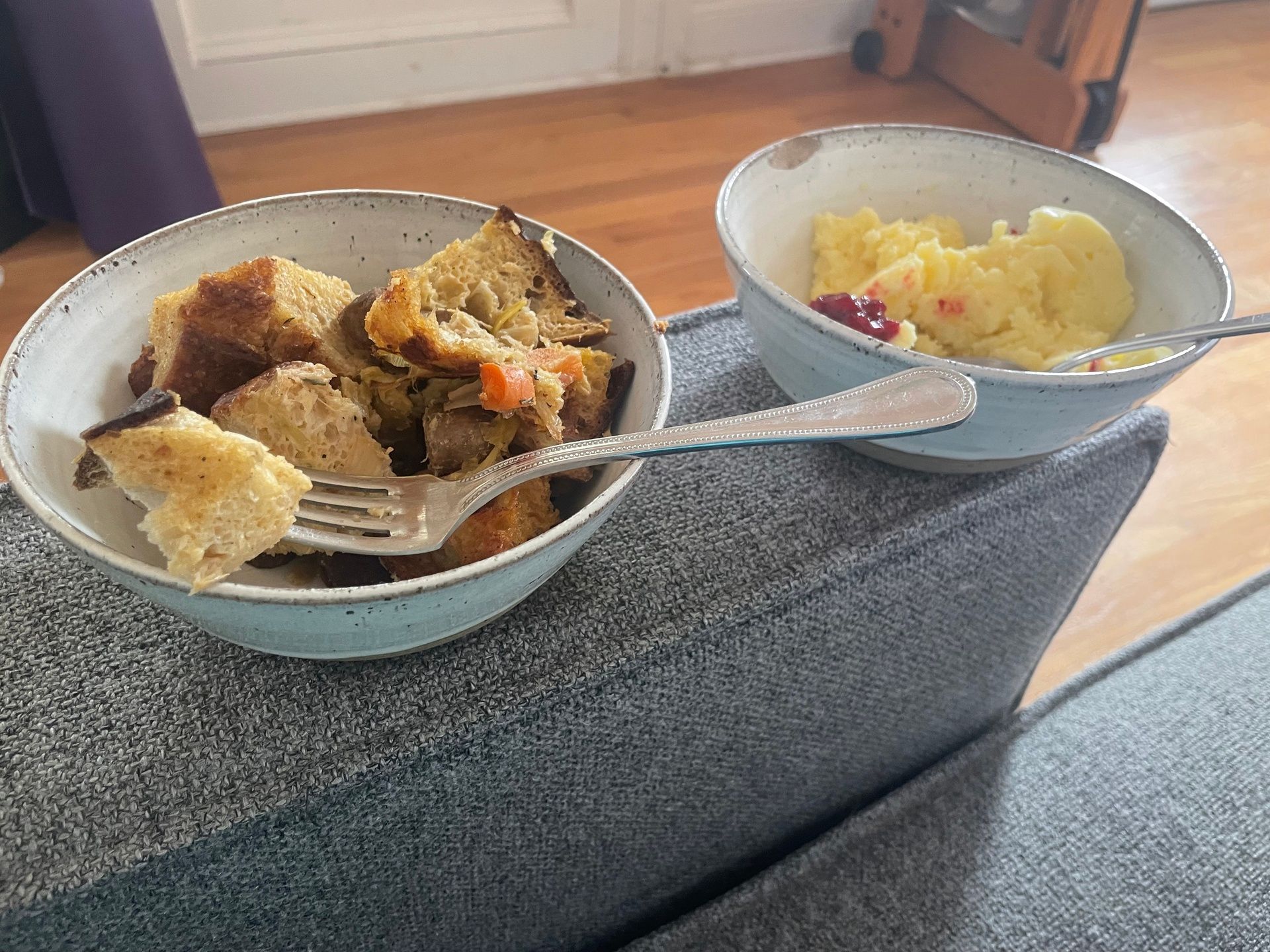 stuffing and mashed potato bowls on the couch … aka living the dream 