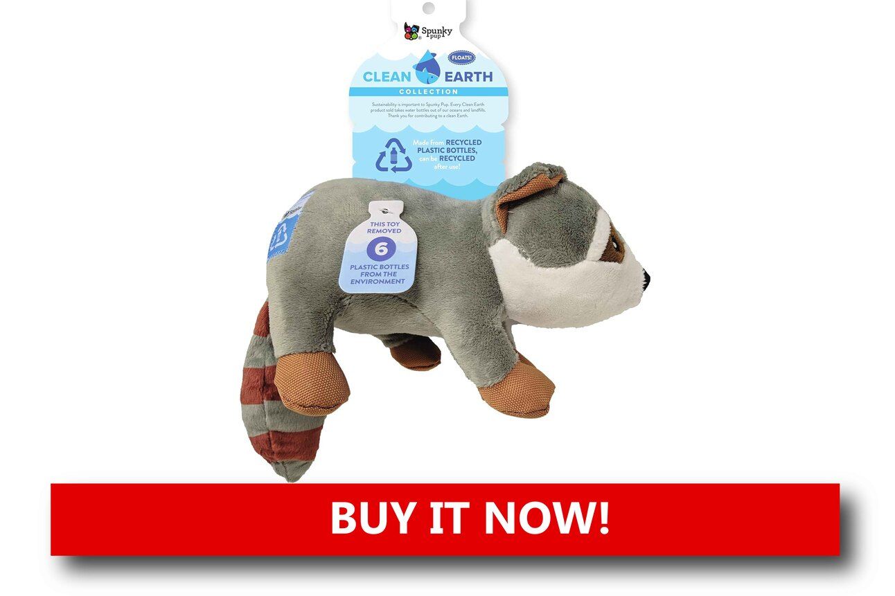 Recycled Fabric Pet Toys Alt text: A set of colorful pet toys made from recycled fabric, including a cotton rope tug and a stuffing-free plush toy, displayed on a natural wood floor with a playful dog nearby.