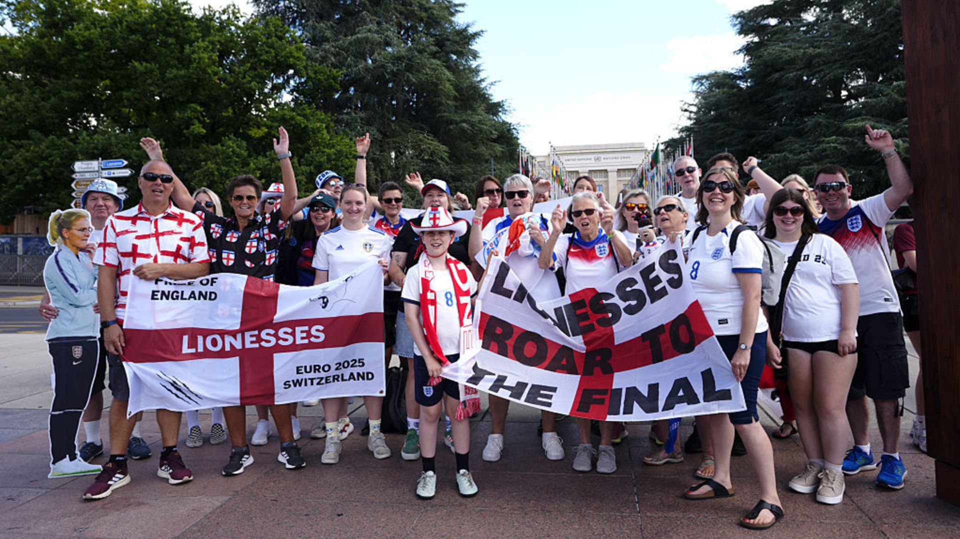 England fans pose for a photograph ahead of the UEFA Women's Euro 2025 semi-final match at the Stade de Geneve, Switzerland.