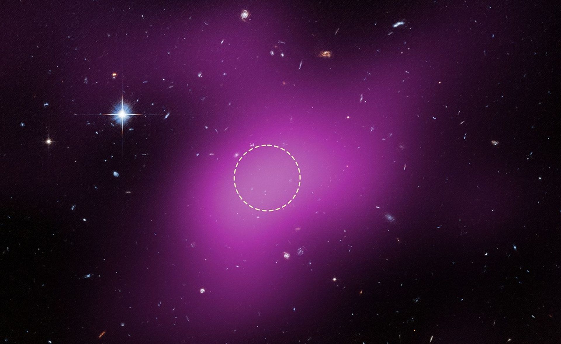 This image pinpoints the location of Cloud‑9, about 14 million light‑years away. The magenta overlay shows radio data from the Very Large Array, highlighting the cloud’s signal, with the dashed circle marking the peak emission where astronomers searched for stars. Hubble’s Advanced Camera for Surveys later confirmed that no stars exist within the cloud; the few visible objects are background galaxies. Prior to these observations, Cloud‑9 could have been interpreted as an extremely faint dwarf galaxy, but Hubble data show it is truly starless.
